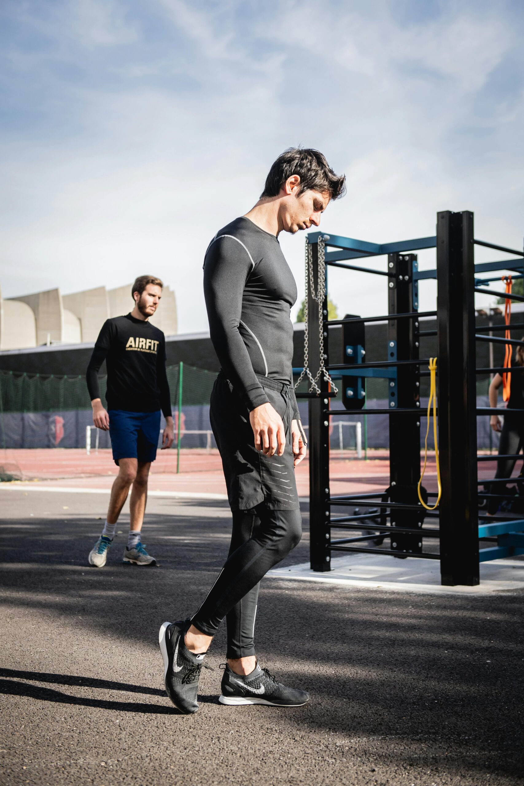 Two men working out in an outdoor urban gym in Boulogne-Billancourt, France.